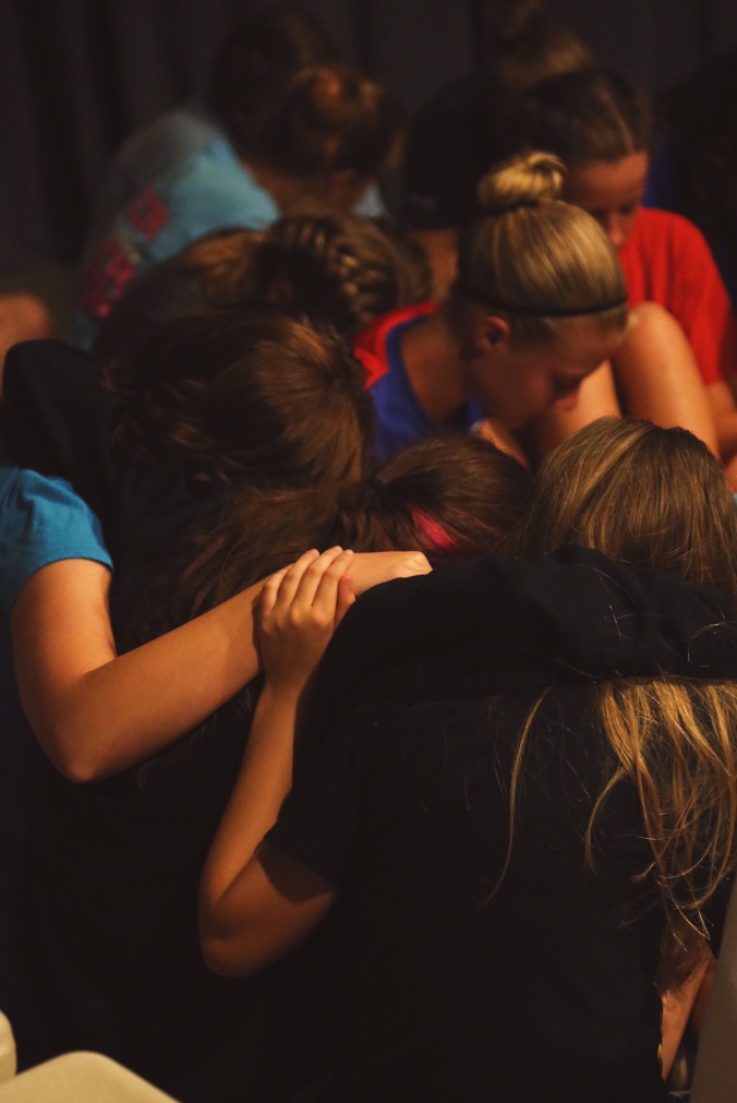 Teens Praying Together at Whisper Mountain Camp